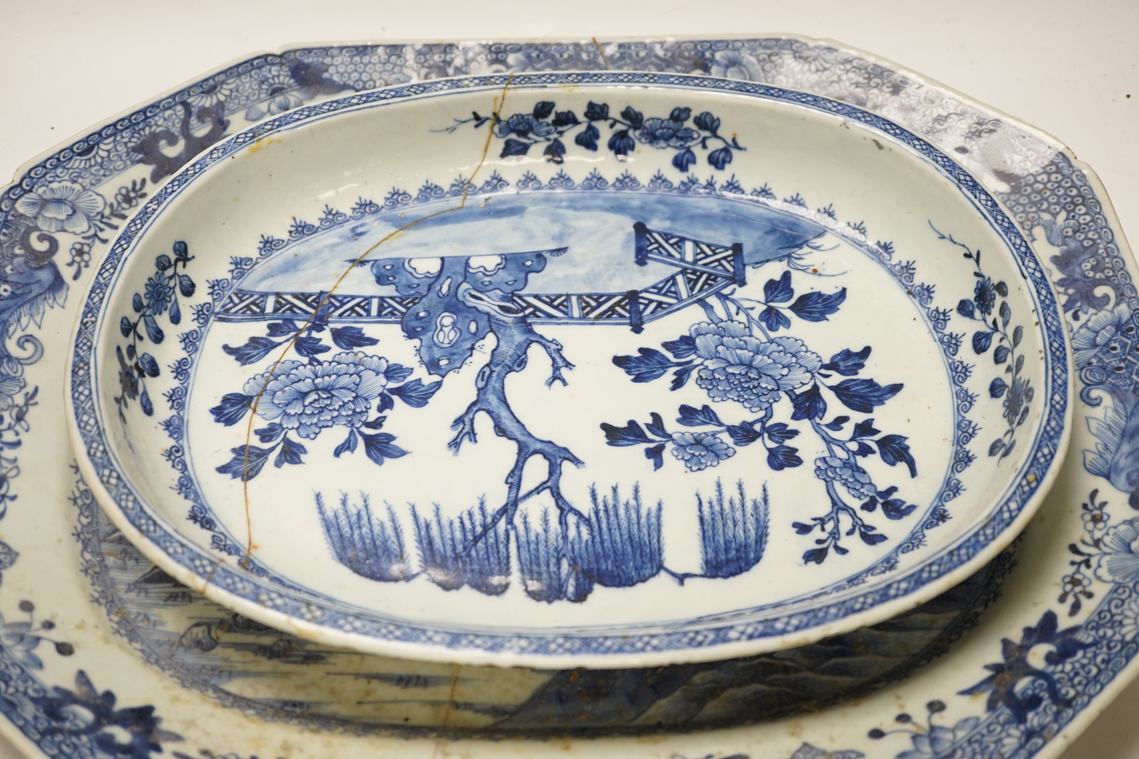 Three 18th century Chinese blue and white export dishes, largest 46x39cm